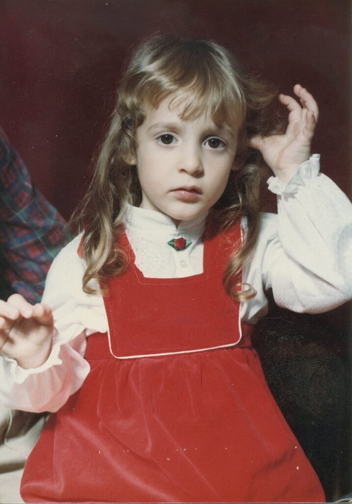 A photo of a girl in a red dress